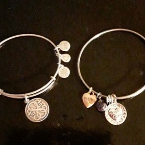 Two bangle bracelets, one is Alex and Ani